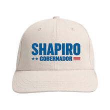 Load image into Gallery viewer, Beige baseball cap with blue "Shapiro Gobernador" text and red, white, and blue flag detail on front.
